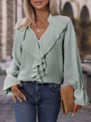 Anika - Blouse élégante à manches longues, col en V et volants à pois suisses