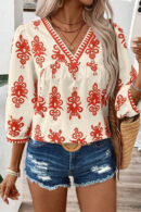 Joy - Blouse élégante à imprimé géométrique, manches mi-longues et col en V